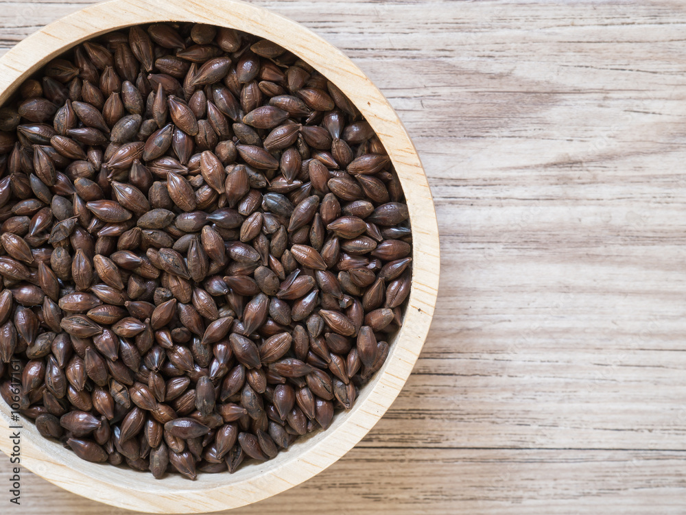 Fototapeta premium Top view - Beer ingredients, Chocolate malt on wooden background ( Space and composition for text )