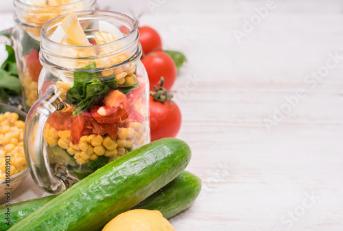 Homemade healthy salad in glass jar. Vegetarian concept. Background.