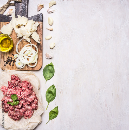 Wallpaper Mural homemade burgers, ground beef, herbs, oil and onion border ,place for text  on wooden rustic background top view Torontodigital.ca