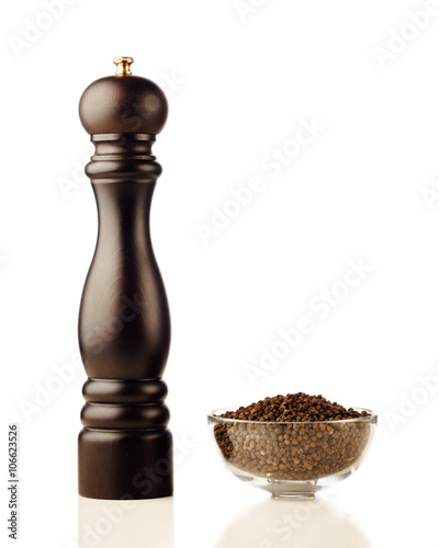 pepper mill and peppercorns, isolated on white