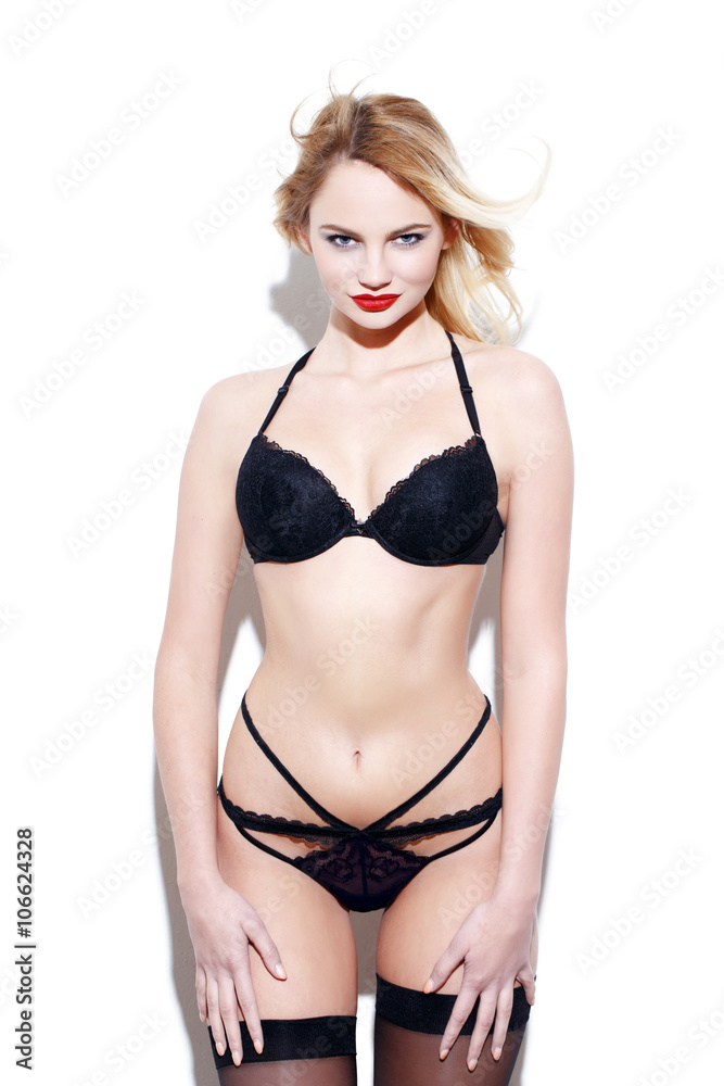 Sexy blonde woman in black underwear