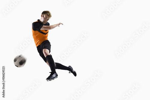 Athlete kicking soccer ball © xixinxing