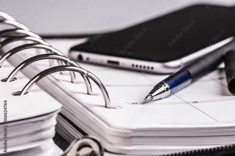 planning concept - calendar, cellphone, pen