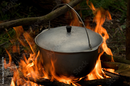 pot with a lid on the fire