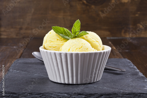 Lemon ice cream with mint leafs. photo