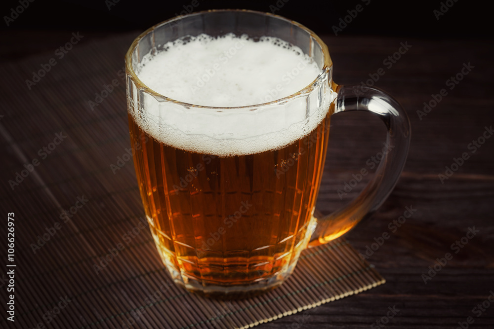 Beer and dried fish on dark wooden table. Beer and dried fish on dark wooden table.
