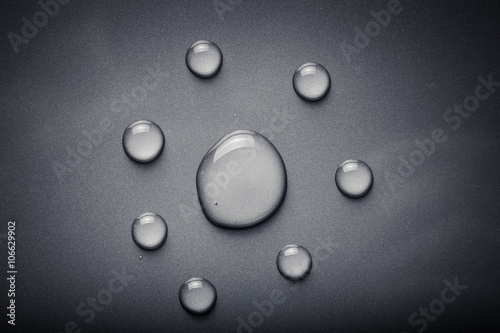 Dops of water on a color background. Gray. Toned