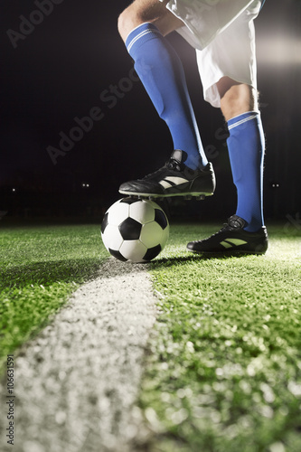 Foot on soccer ball