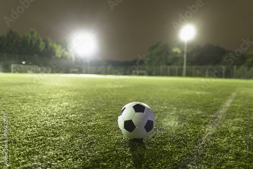 Fototapeta Naklejka Na Ścianę i Meble -  Soccer ball on sports field