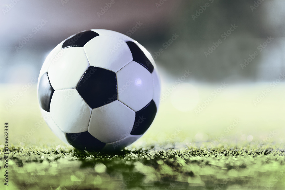 Fototapeta premium Soccer ball on sports field
