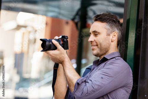 Male photographer taking picture