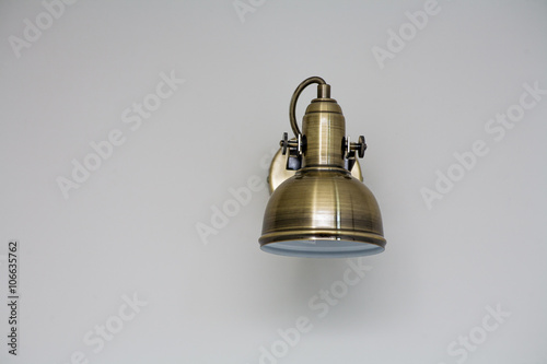 Modern wall lamp on white wall, copyspace