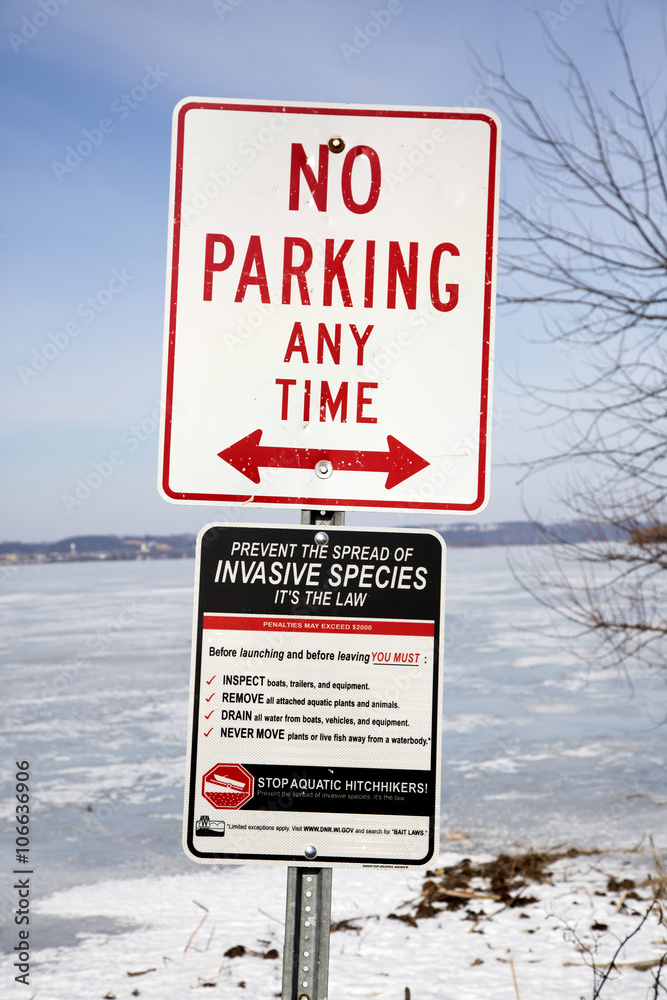 Not Invasive Animal Sign No parking and invasive species sign Stock Photo | Adobe Stock