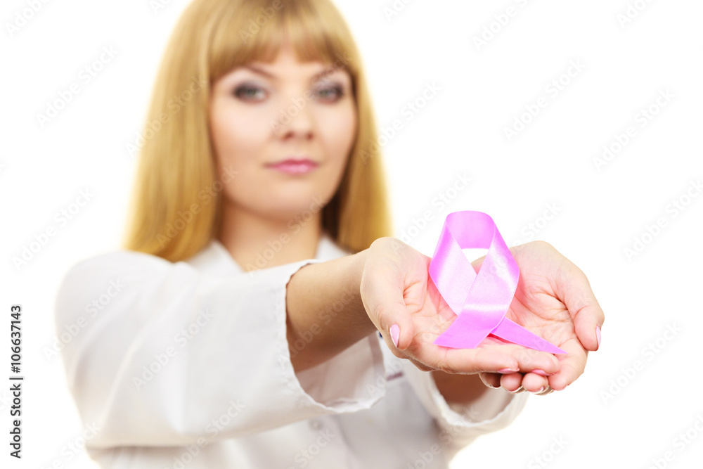 Doctor showing pink cancer awareness ribbon Doctor showing pink cancer awareness ribbon