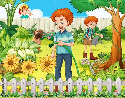 Father and son watering the plants in the garden