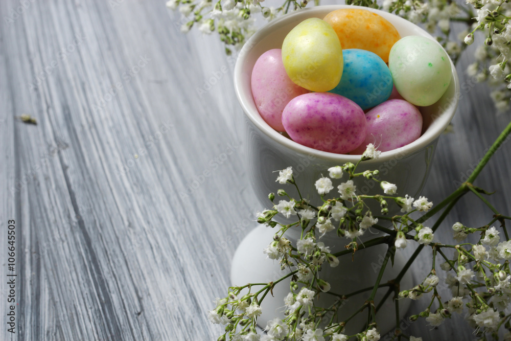 Easter Candy with spring flowers close up with copy space, selective focus. Easter Candy with spring flowers close up with copy space, selective focus.