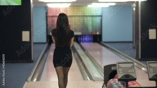 Woman playing bowling photo