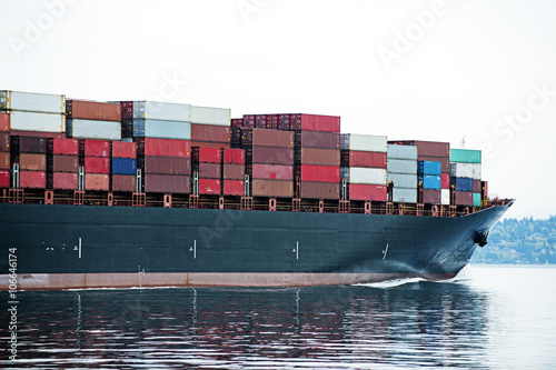 Cargo container ship on ocean photo