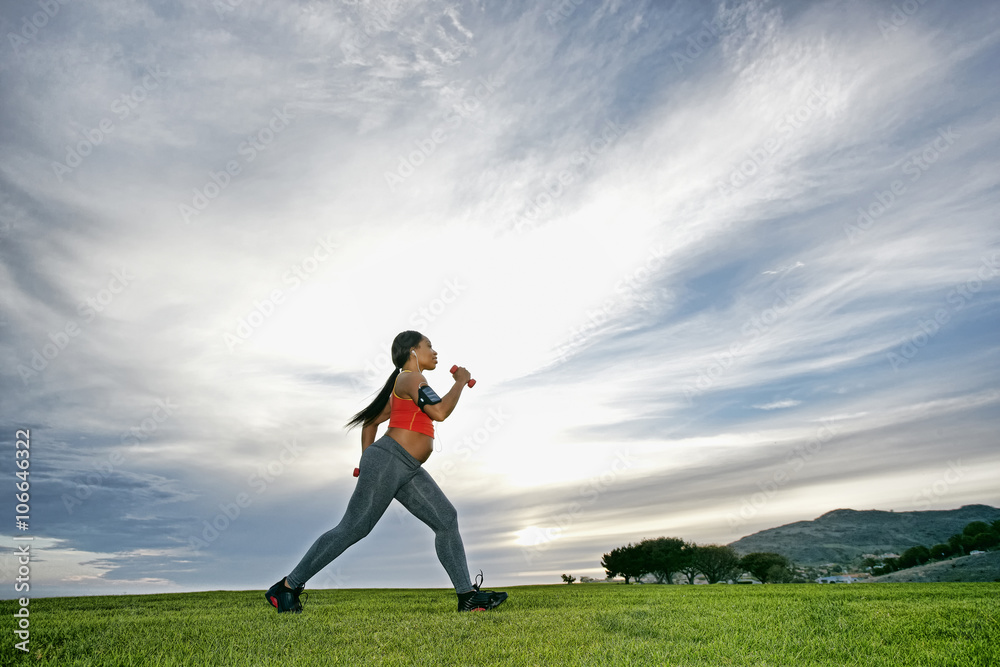 Pregnant woman exercising in park Pregnant woman exercising in park
