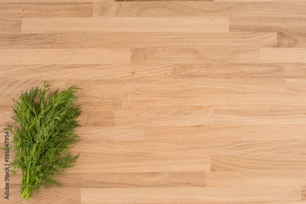 Dill on a wooden background Dill on a wooden background