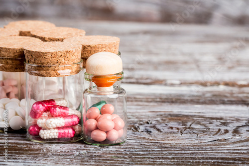 Fotografija Various medicine in glass containers with cork caps