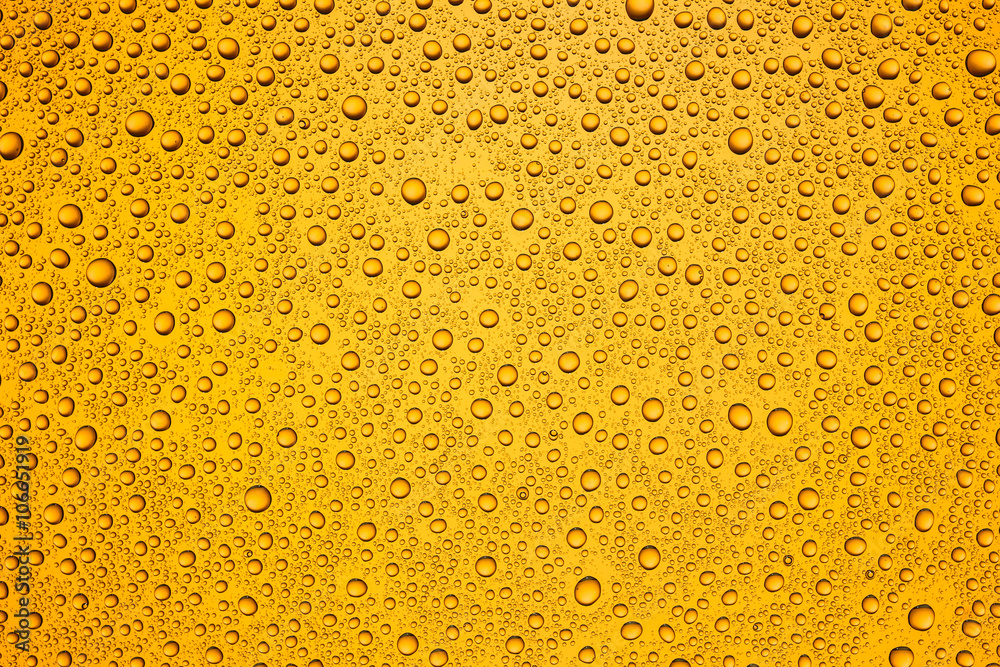 Water drops on orange glass surface texture. Water drops on orange glass surface texture.