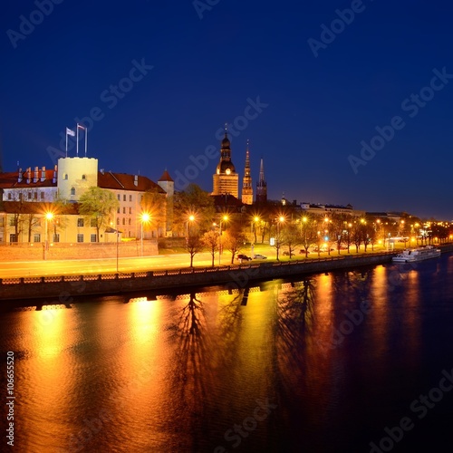 general view on Riga embankment and its illumination during nightfall, Latvia