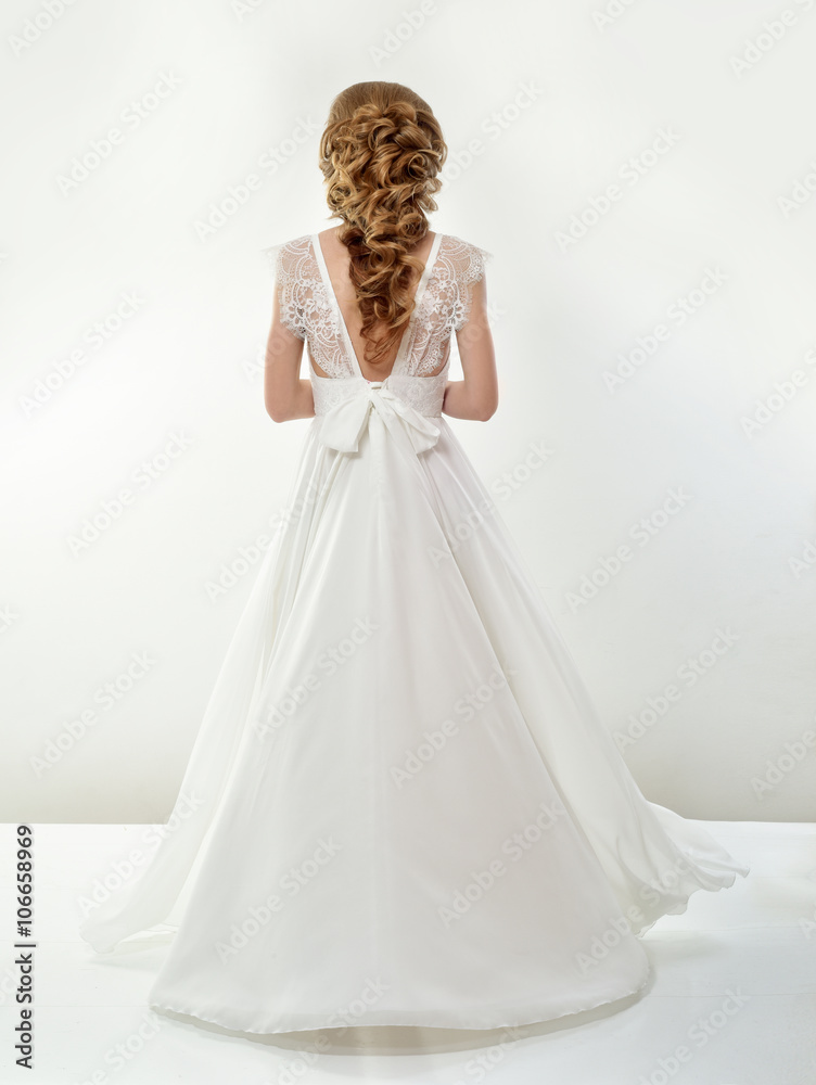 Beautiful bride in a luxurious wedding dress Beautiful bride in a luxurious wedding dress