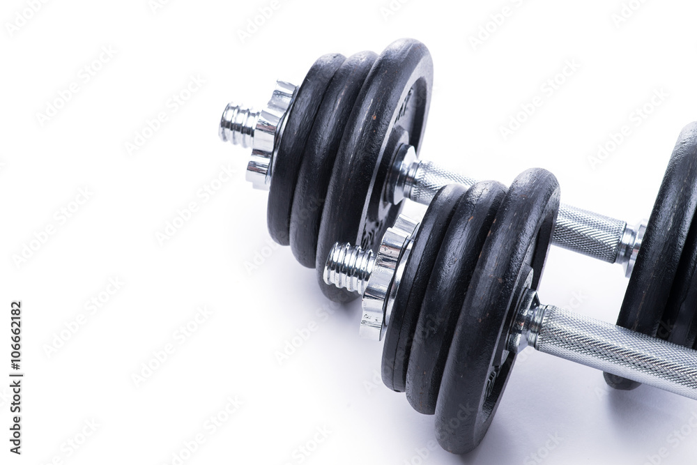 Black dumbbells on white background Black dumbbells on white background
