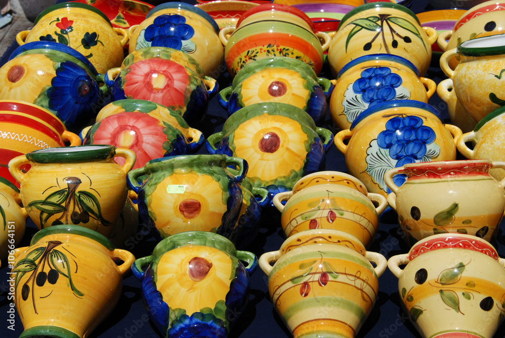 Colourful ceramic wall pots for sale at a street market in Benalmadena.