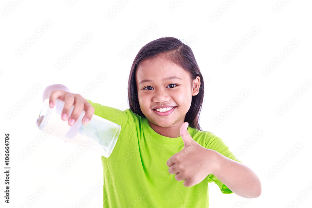 Portrait of young Asian girl holding milk glass isolated on whit Portrait of young Asian girl holding milk glass isolated on whit