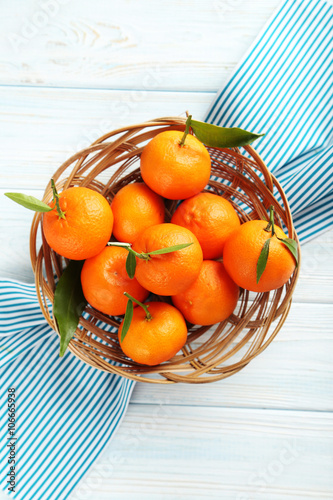 Fototapeta Naklejka Na Ścianę i Meble -  Ripe mandarin on a blue wooden table