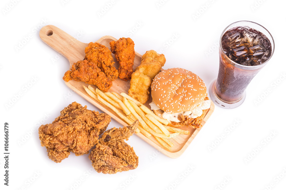 Naklejka premium Fried chicken, french fries and soft drink on wooden table