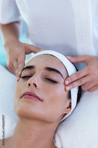 Woman receiving a temple massage