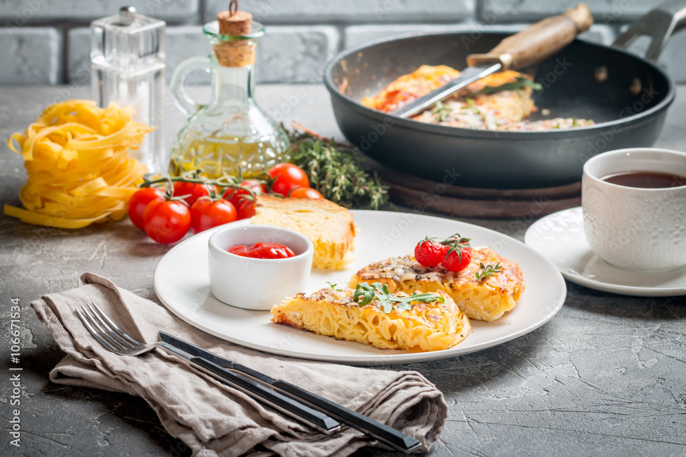 pasta casserole with eggs, sun-dried tomato and cheese