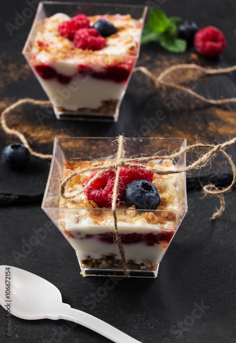 glass dessert with yogurt cream and red fruits photo