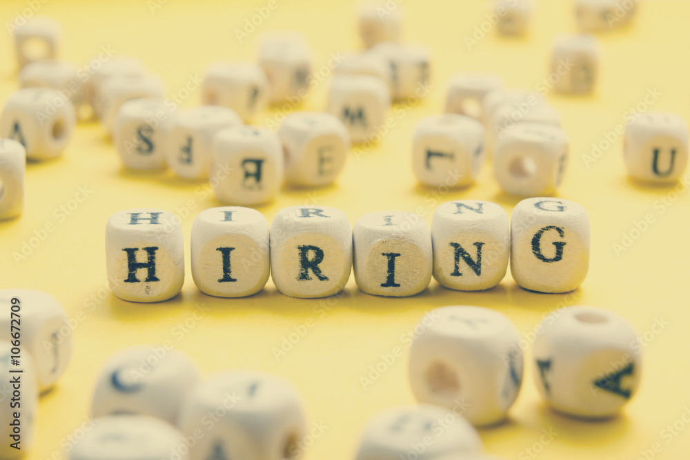 HIRING word written on wood block. Wooden Abc HIRING word written on wood block. Wooden Abc