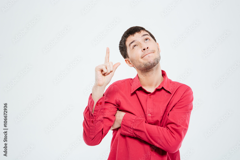 Casual man pointing finger up Casual man pointing finger up