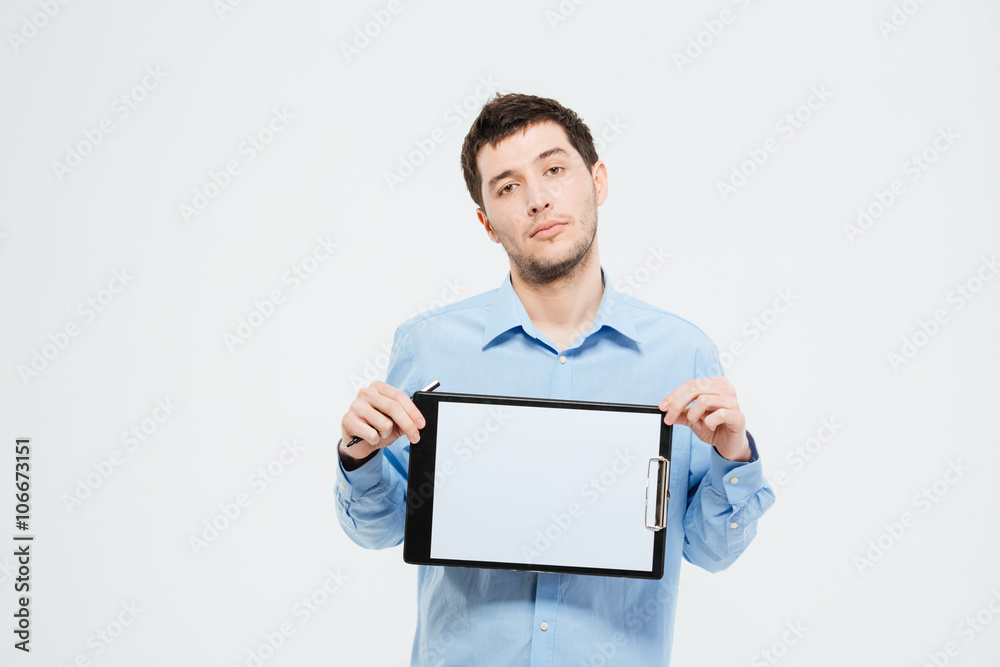 Businessman holding blank clipboard Businessman holding blank clipboard