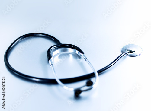 Medical equipment  stethoscope on a blue toned background. 