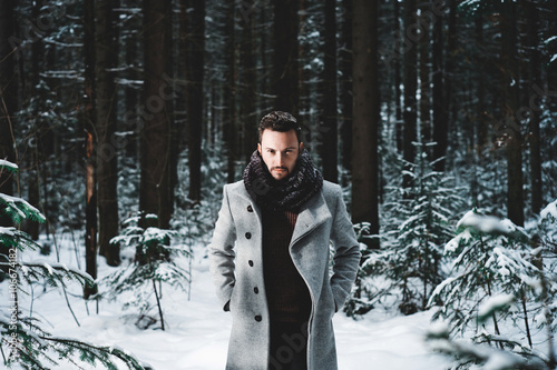 Fashionable handsome man in winter coat photo