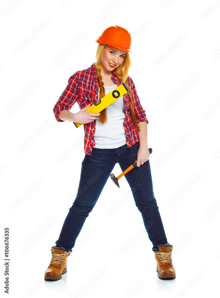Young woman in helmet with the work tools on a white Young woman in helmet with the work tools on a white