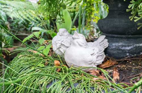 Bird stone sculpture in the garden
