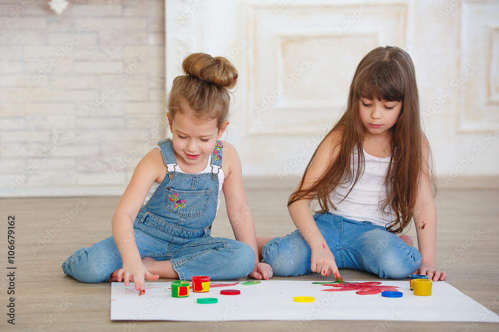 two beautiful little girls paint two beautiful little girls paint