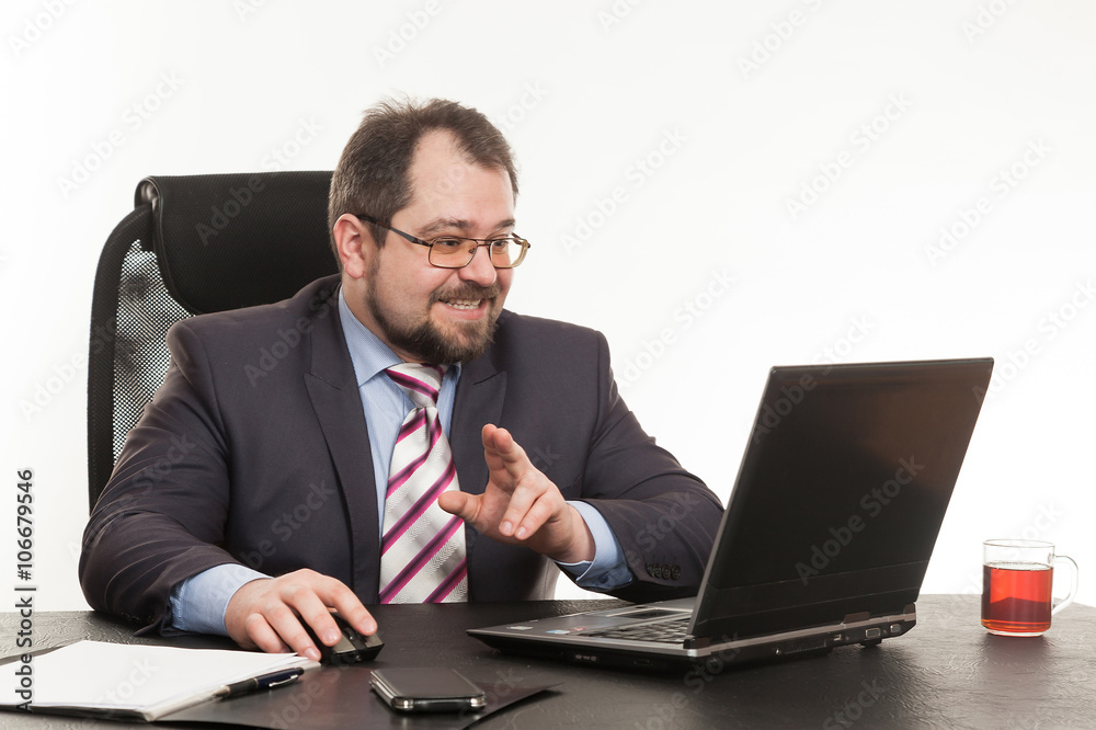 the businessman sits at office table the businessman sits at office table