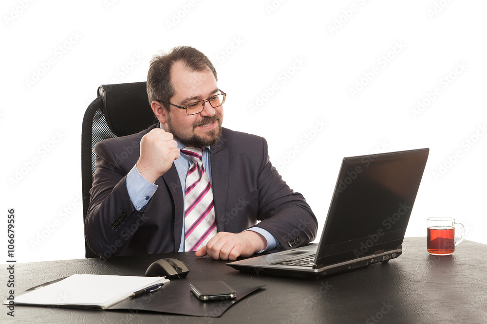 the businessman sits at office table the businessman sits at office table