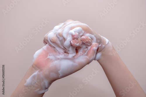 Women washing of hands with soap foam ,nice soft background