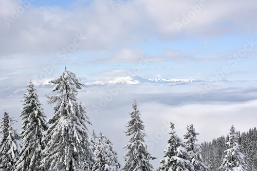 Postavaru Mountains in winter. The altitude of the peak is 1799 meters. Poiana Brasov, Romania