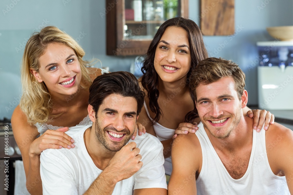 Beautiful young couples smiling at home Beautiful young couples smiling at home