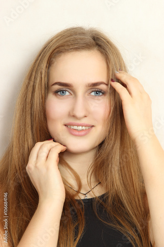 portrait of the nice young girl on a white background